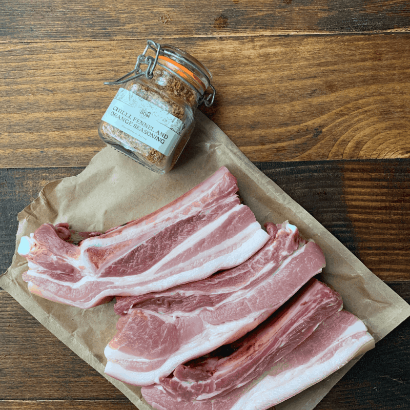 chilli, fennel and orange roast pork belly with roast radishes